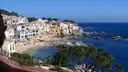 The white houses of Calella de Palafrugell around a small sandy bay on the Costa Brava