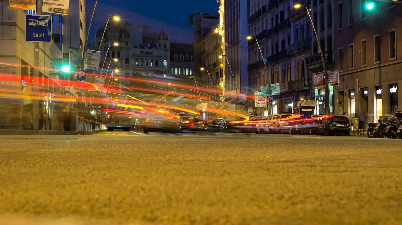 Car light trails on a Barcelona street in the evening