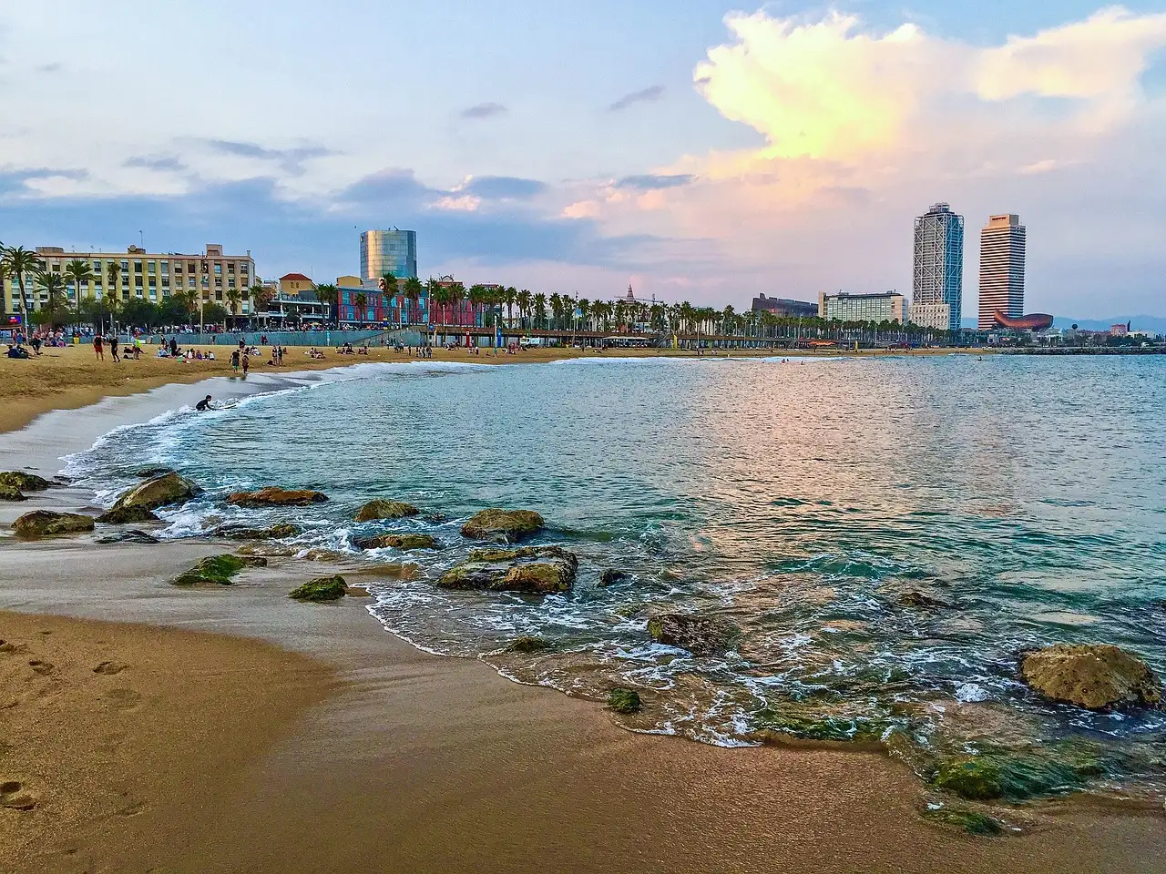 Barcelona's beach and seafront promenade with the two Port Olímpic towers behind