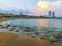 Barcelona's beach and seafront promenade with the two Port Olímpic towers behind