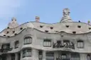 The wavy stone front of Casa Milà, with iron balconies and rooftop chimneys