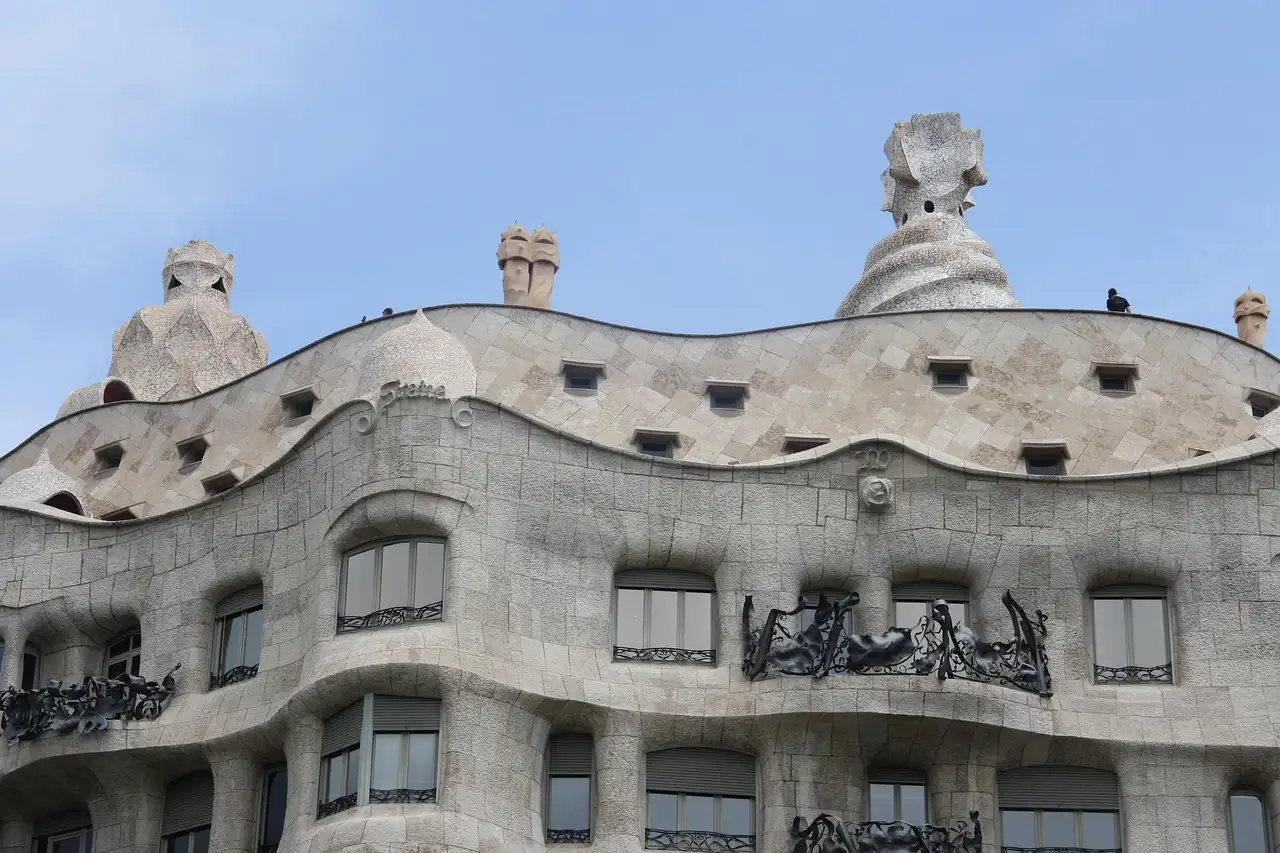 The wavy stone front of Casa Milà, with iron balconies and rooftop chimneys