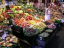 Fruit and vegetable stalls inside La Boqueria market hall