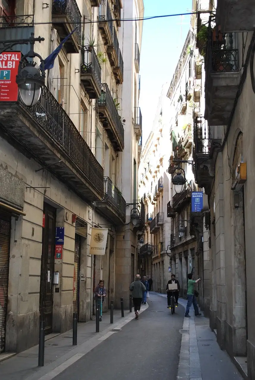A quiet narrow alley between old houses in Barcelona