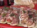 Toasted bread slices topped with Spanish cured ham