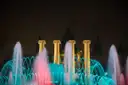 Magic Fountain of Montjuic lit pink and turquoise at night