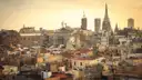 Golden-hour view over Barcelona old-town rooftops and cathedral spires