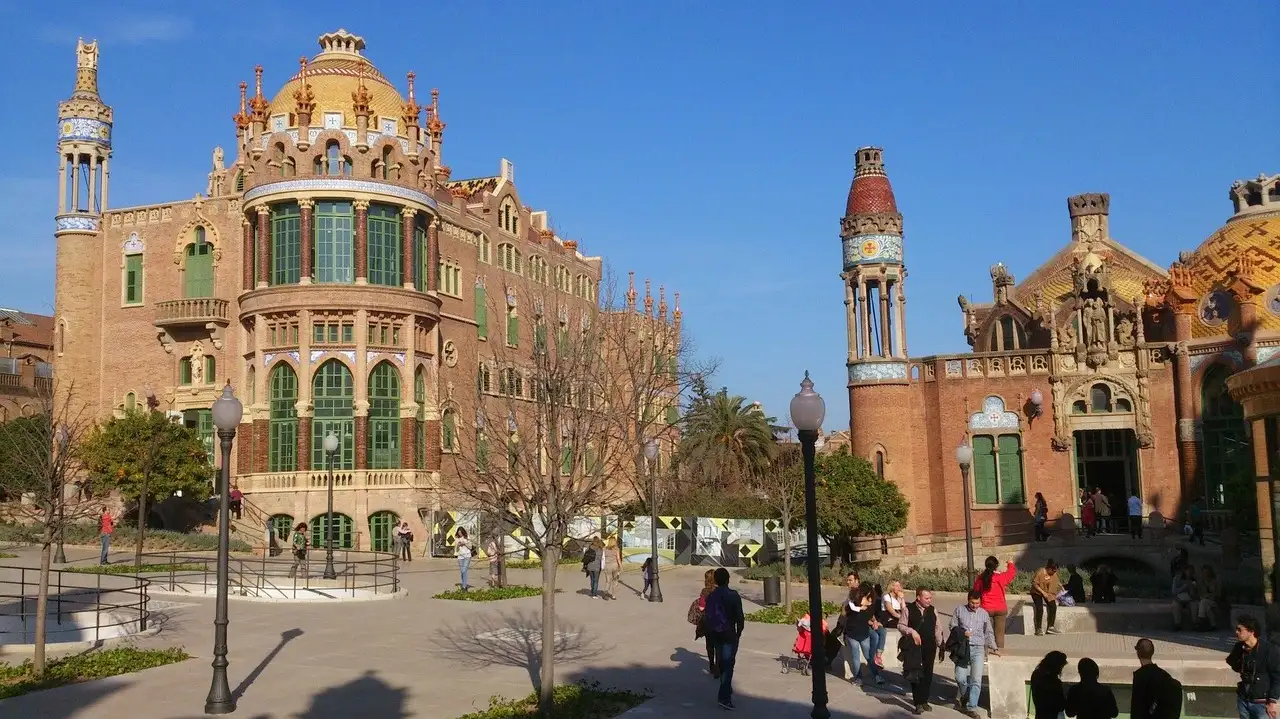 The red-brick and tiled pavilions of Sant Pau Recinte Modernista with a domed tower