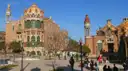 The red-brick and tiled pavilions of Sant Pau Recinte Modernista with a domed tower