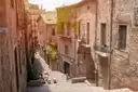 Stone steps climbing between old stone houses in Girona's old town